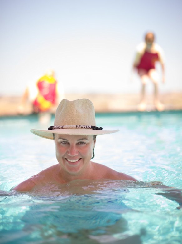 Carolyn Creswell and her children enjoy the pool at their hilltop home.
