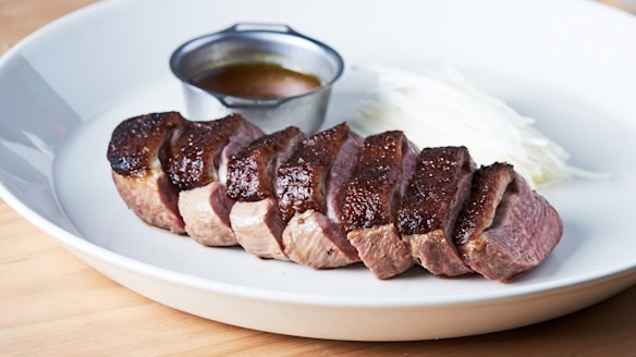 Go-to dish: Thick slices of smoked duck served with steamed buns.