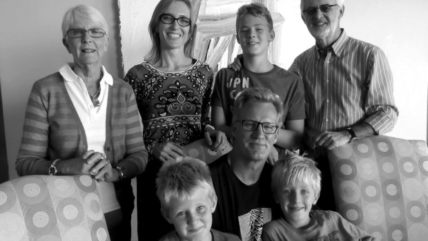Lynagh (centre) with his family (back row, from left) mother Marie, wife Isabella, son Louis, father Ian and (front row) sons Thomas and Nicolo.