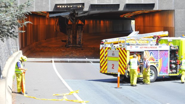 Parkes Way has been blocked after a truck damaged the roof of the tunnel.