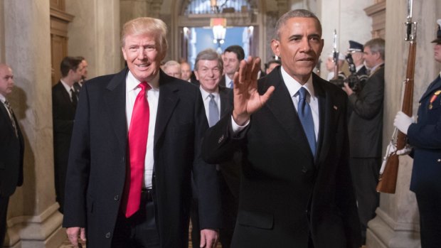 Changing of the guard: Donald Trump and Barack Obama arrive for the inauguration.