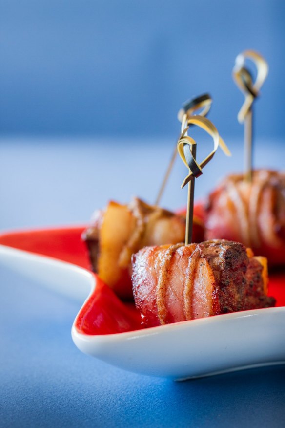 Duck liver wrapped in bacon. 