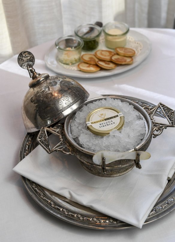 The caviar service in antique silverware.