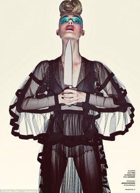 Elle Fanning appears in a sheer garment with a knife to her chin in a shoot for V Magazine.