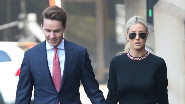 Stockbroker Oliver Curtis (left) arrives with his wife Roxy Jacenko at the Supreme Court in Sydney on Thursday.