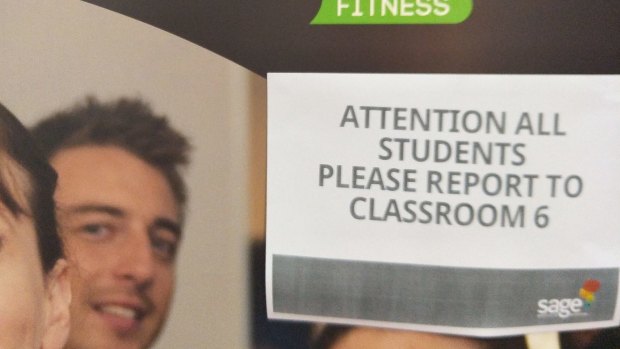 A sign taped up at Sage's Collins Street classrooms on Wednesday