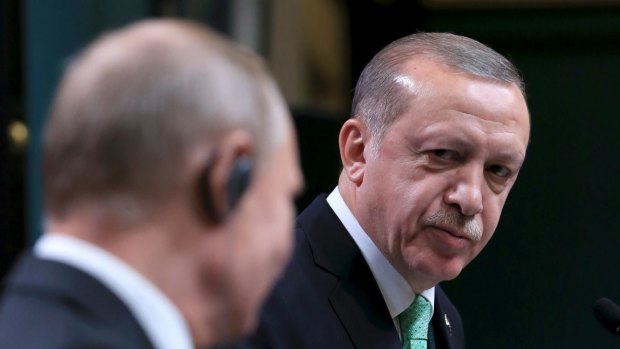 Turkish President Recep Tayyip Erdogan, right, listens to Russian President Vladimir Putin, left, following their meeting in Ankara, Turkey, also on Monday.