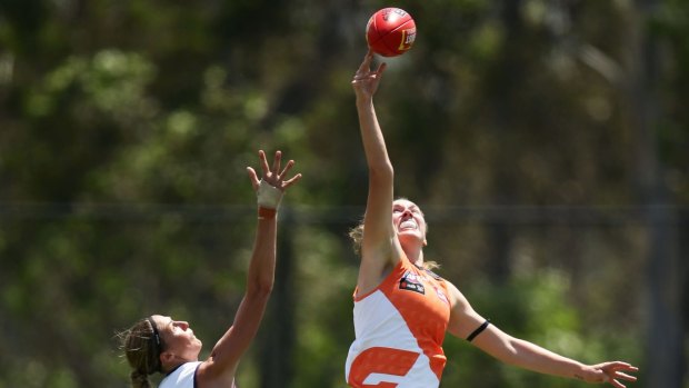 Rising Star: Erin McKinnon rises high in the ruck against Fremantle.