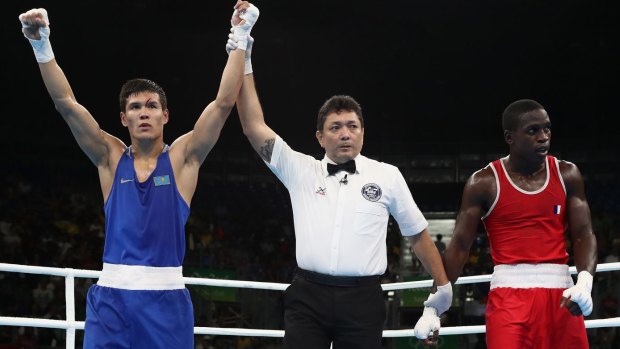 Cult figure: Boxing referee Jones Kennedy Silva da Rosario adjudicates another bout. 