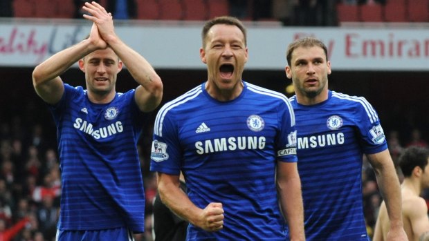Chelsea's captain John Terry, centre, celebrates at the final whistle after his team's draw with Arsenal.