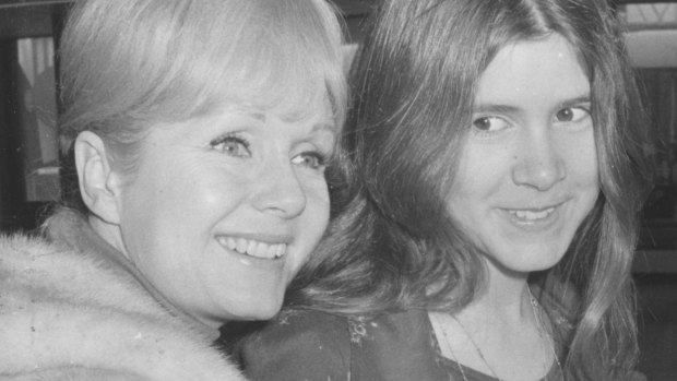 Debbie Reynolds at Heathrow with her daughter Carrie Fisher, aged 15, in 1972. 