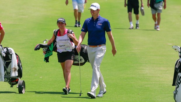 Red hot: Adam Blyth and his caddy girlfriend Nicole Kelsey have shot to the top of the NSW Open leaderboard.