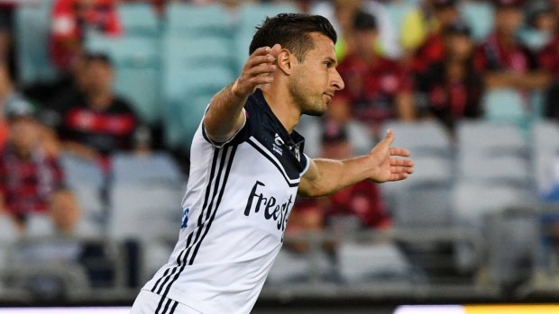 Brace complete: Kosta Barbarouses reacts after scoring his second goal.
