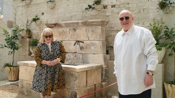 Mallory Wall and Ronnie Di Stasio in front of the Roman fountain that anchors the courtyard of the new Carlton venue.