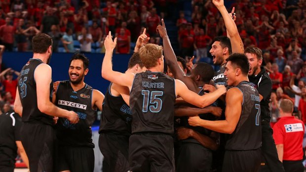The Breakers celebrate after a three-point shot on the buzzer from half-court sealed a thrilling overtime win against the Wildcats.