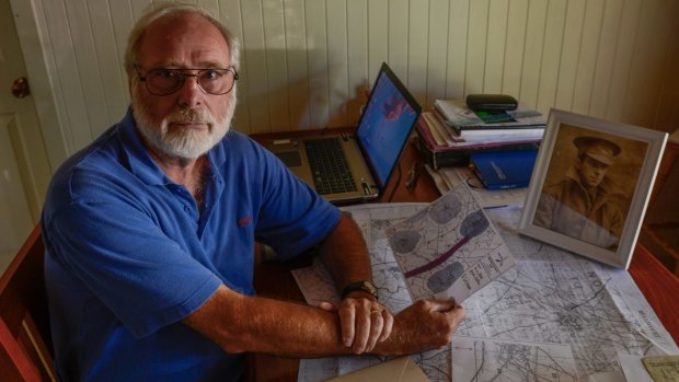 Peter Norton with his maps of battle fields at Bullecourt.