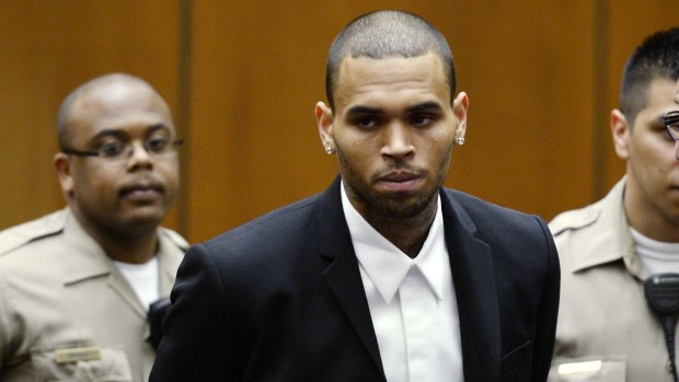 Chris Brown, pictured during a probation hearing in 2013, is again being investigated over a violent incident.