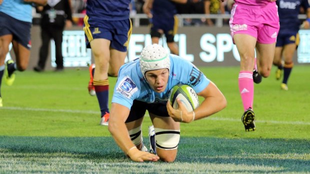 Bright spot: Stephen Hoiles scores a try against the Highlanders.
