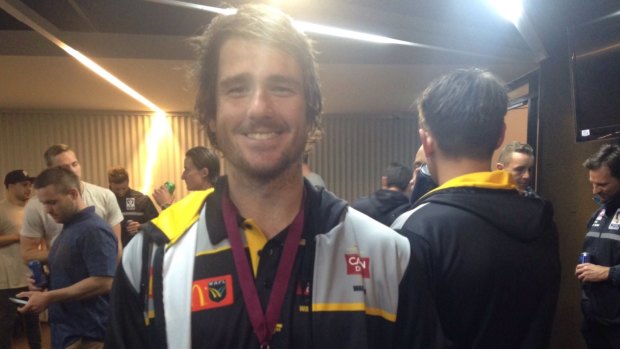 WA player Ben Saunders is all smiles despite getting the wrong medal.
