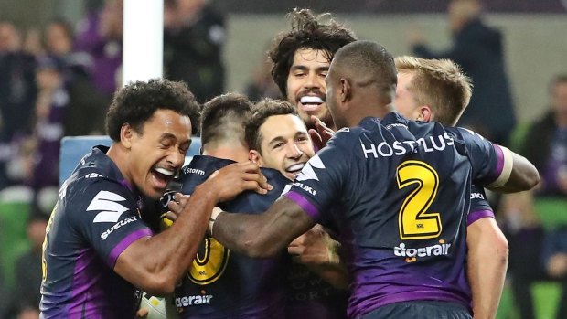 Billy burns: Slater and his Storm teammates celebrate a try in Friday night's dominant win against Newcastle at AAMI Park. 