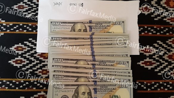 Three of six: Money Indonesian police say was used to pay people traffickers.