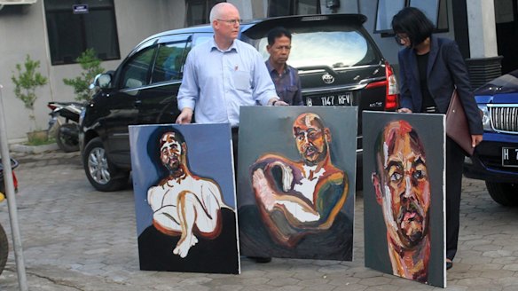 Bali nine lawyer, Julian McMahon, with three recent paintings by Myuran Sukumuran, among them one marked "Self Portrait, 72 hours just started" as Sukumuran began the countdown to his execution.