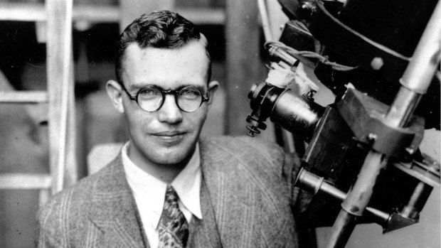 Clyde Tombaugh with the telescope through which he discovered Pluto, at the Lowell Observatory on Observatory Hill in Flagstaff, Arizona, in 1931.  