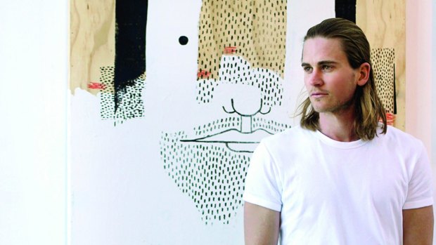 Canberra artist Luke Chiswell with one of his artworks.