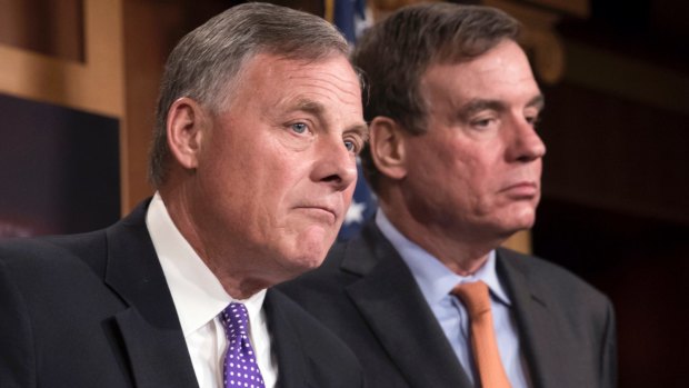 Senate Select Committee on Intelligence chairman Richard Burr, left, and vice-chairman Mark Warner update reporters on the status of their inquiry into Russian interference in the 2016 US election.