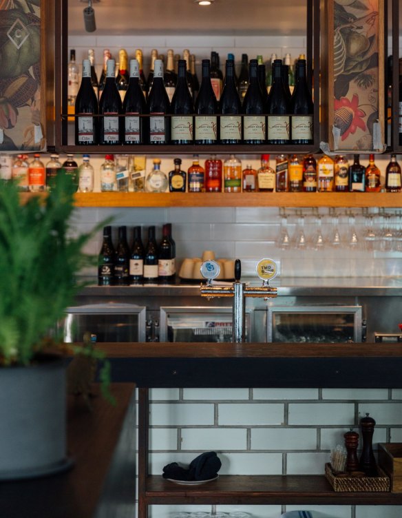 The room's new face has floral decals and shelves stocked with sherry.