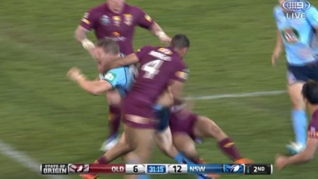 Justin Hodges makes high contact with Ryan Hoffman in the first half.