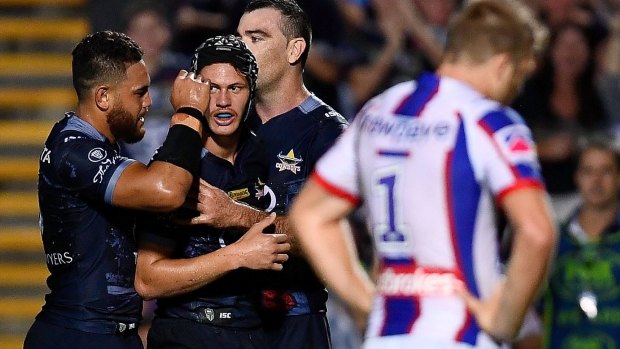 Man of the moment: Kalyn Ponga is congratulated by his teammates after dotting down.