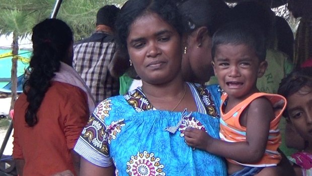 Sri Lankans in a tent on the beach of Aceh Besar awaiting their boat to be fixed so they can continue their trip to Australia.