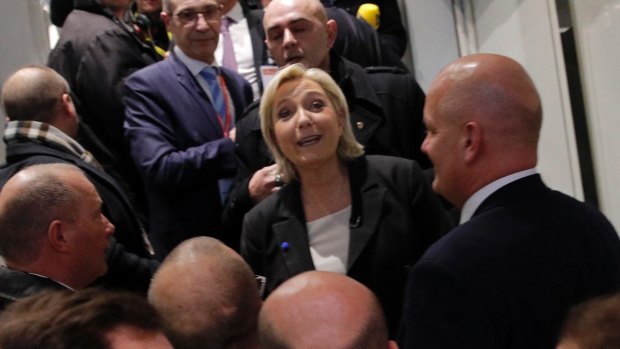 Marine le Pen, centre, visits the Entrepreneur Fair in Paris.