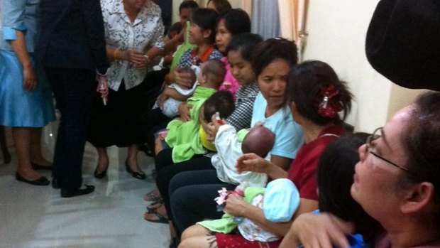 Thai nannies holding nine suspected surrogate babies after a police raid at a residential apartment on the outskirts of Bangkok, Thailand, last year.