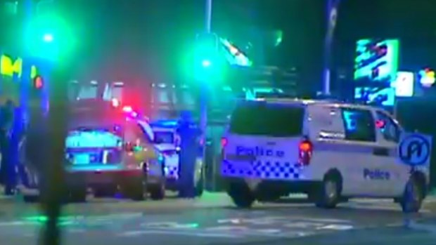 Police said a number of shots were fired by the officers at the Surfers Paradise property after a man allegedly opened fire.