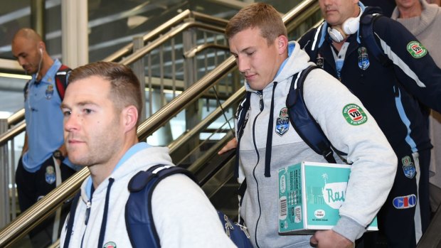 Back with a case ... of coconut water: Trent Merrin and Trent Hodkinson arrive back in Sydney on Thursday.