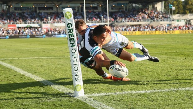 Flying: Valentine Holmes scores against the Gold Coast last weekend.
