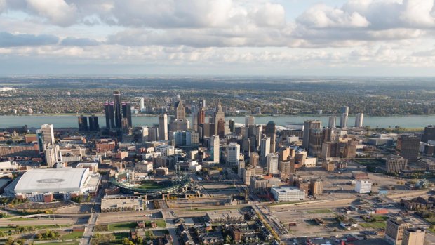 The Detroit city centre with Windsor, Ontario, on the horizon, across the Detroit River which forms the US-Canada border. 