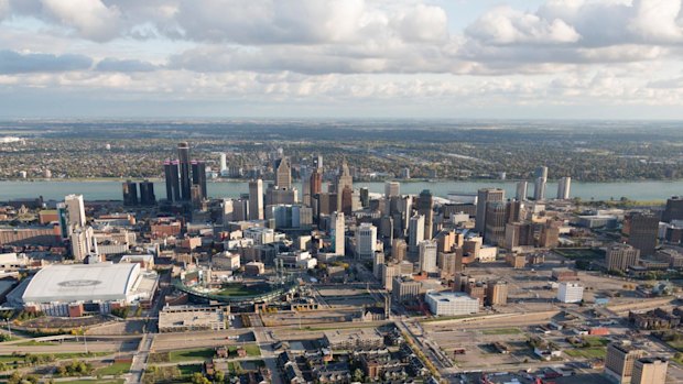 The Detroit city centre with Windsor, Ontario, on the horizon, across the Detroit River which forms the US-Canada border. 