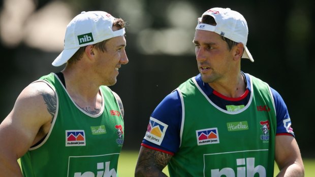 Low-key debut: Mitchell Pearce (right) takes time out at Knights training with teammate Trent Hodkinson.