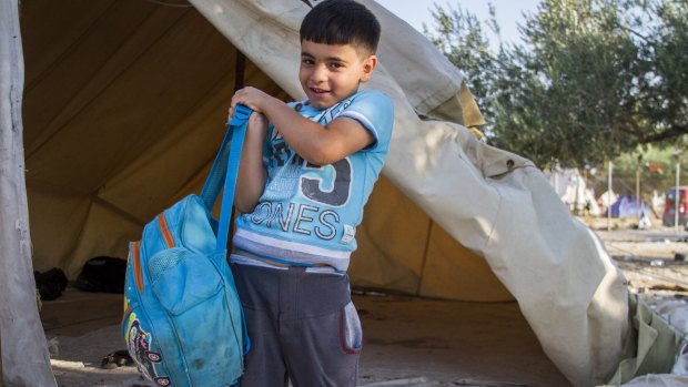 Omran, 6, fled Syria with his family carrying only this bag.