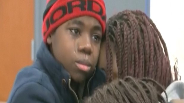 Tearful reunion: The rescued boy is reunited with his mother. 