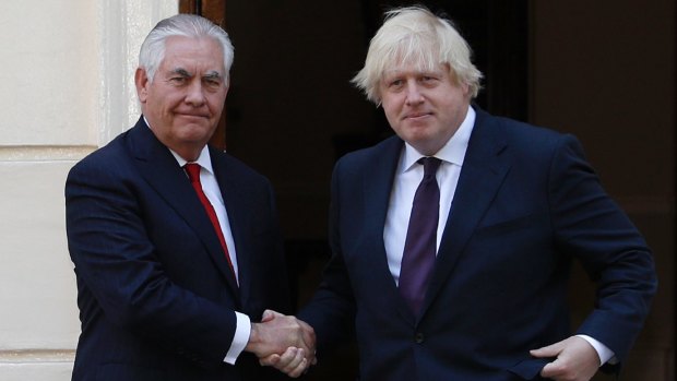 Britain's Foreign Secretary Boris Johnson, right, greets US Secretary of State, Rex Tillerson in London on May 26. 