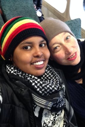 Hani Abdile with Janet Galbraith on the ferry to Manly in 2015, after Hani was moved to community detention in Sydney.