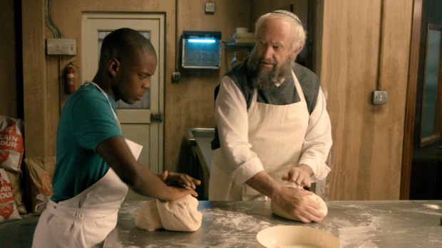 Jerome Holder and Jonathan Pryce as Ayyash and Nat in Dough.