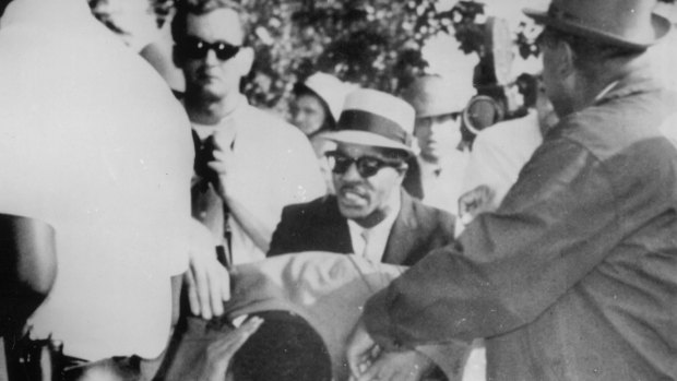 Dr Martin Luther King jnr holds his head after being struck by a rock as he was leading about 600 demonstrators on a civil rights march through a Chicago neighbourhood in 1966.