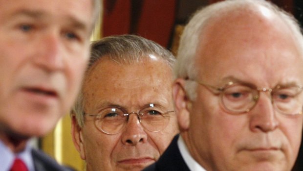 Former president George W. Bush, left, secretary of defence Donald Rumsfeld and vice-president Dick Cheney, who held top roles in the United States when it launched the war in Iraq.