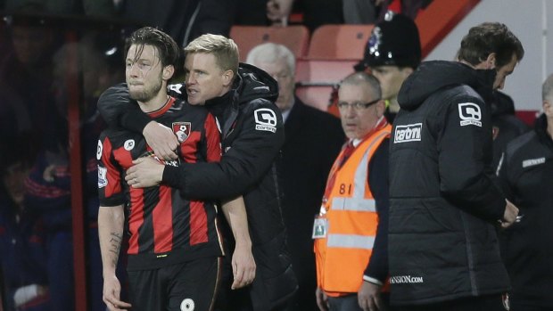 Bournemouth manager Eddie Howe speaks with Harry Arter.
