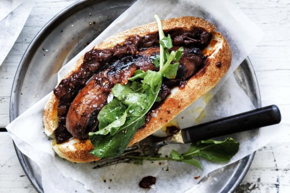 The secret is to cook the snag in sauce: Adam Liaw's perfect barbecued sausage in a bun.